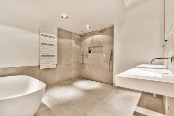 Beautiful bathroom with a big bathtub and white big windows